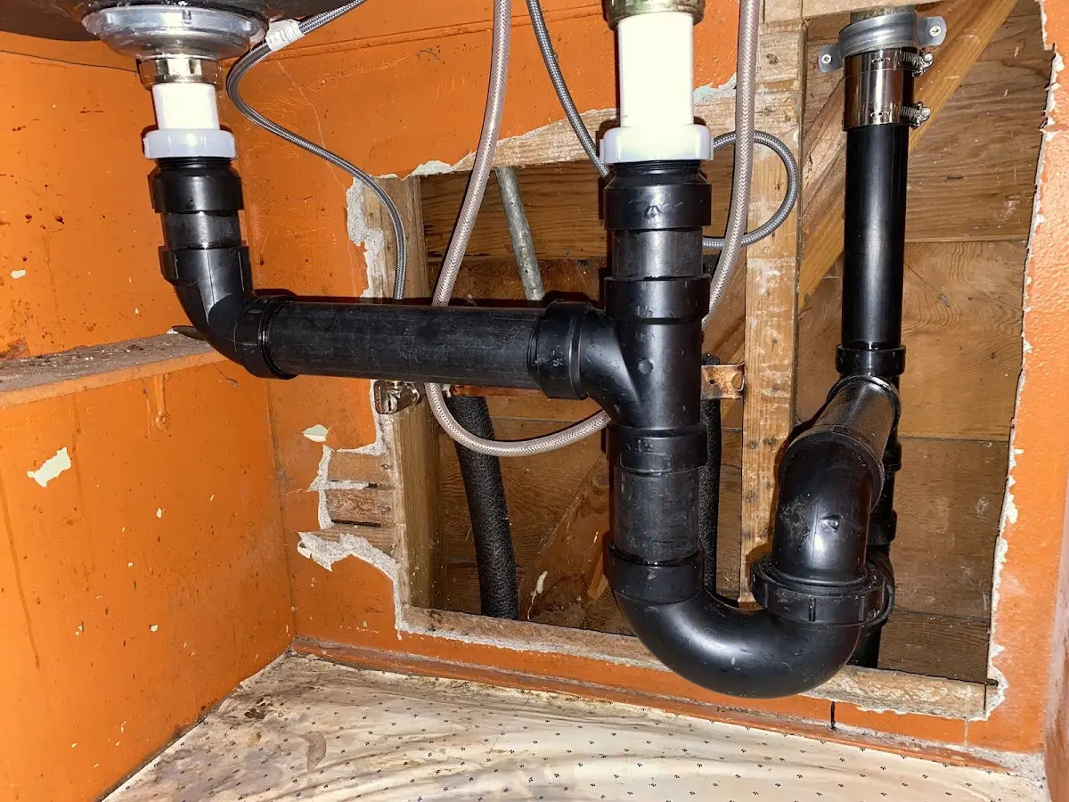 Professional Garbage Disposal Repair equipment and tools on the job in Forestbrook